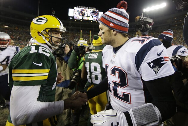 Green Bay Packers' Aaron Rodgers shakes hands with New England Patriots' Tom Brady after an NFL football game Sunday, Nov. 30, 2014, in Green Bay, Wis. The Packers won 26-21. (AP Photo/Tom Lynn)