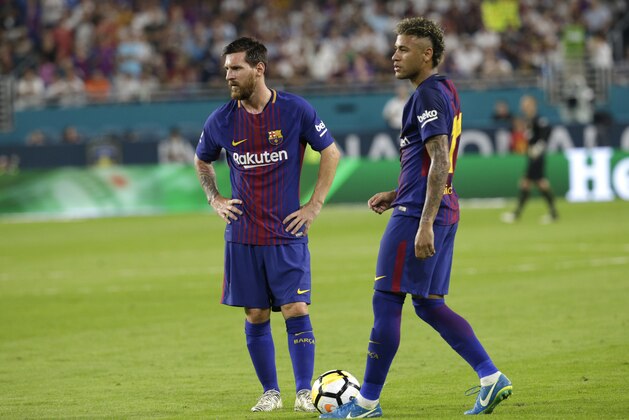 Barcelona's Lionel Messi, left, and Neymar, right, stand on the field during a break in the action during the first half of an International Champions Cup soccer match against Real Madrid, Saturday, July 29, 2017, in Miami Gardens, Fla. (AP Photo/Lynne Sladky)