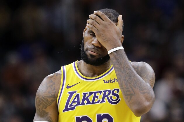 Los Angeles Lakers forward LeBron James (23) holds hand to his head as he reacts to the team not scoring on a play late in the fourth quarter of an NBA basketball game against the San Antonio Spurs, Saturday, Oct. 27, 2018, in San Antonio. San Antonio won 110-106. (AP Photo/Eric Gay)