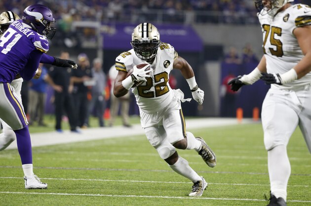 New Orleans Saints running back Mark Ingram (22) runs past Minnesota Vikings defensive end Stephen Weatherly, left, during the second half of an NFL football game, Sunday, Oct. 28, 2018, in Minneapolis. (AP Photo/Bruce Kluckhohn)
