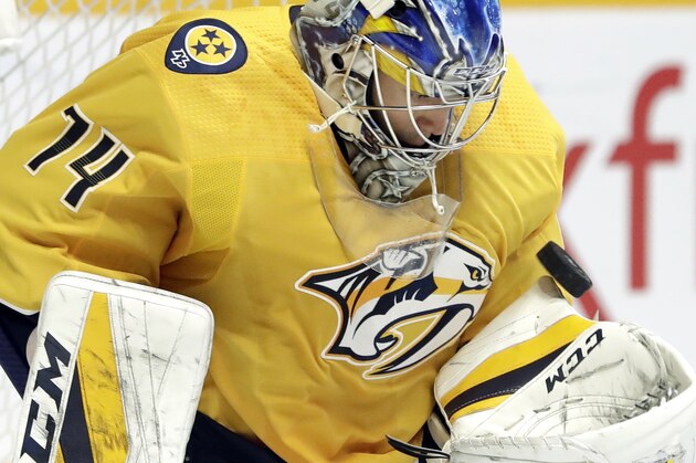Nashville Predators goaltender Juuse Saros, of Finland, blocks a shot by the New York Islanders during the first period of an NHL hockey game Saturday, Oct. 13, 2018, in Nashville, Tenn. (AP Photo/Mark Humphrey)