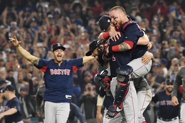 LOS ANGELES, CA - OCTOBER 28:  Christian Vazquez #7 jumps into the arms of Chris Sale #41 of the Boston Red Sox to celebrate their 5-1 win over the Los Angeles Dodgers in Game Five to win the 2018 World Series at Dodger Stadium on October 28, 2018 in Los Angeles, California.  (Photo by Harry How/Getty Images)