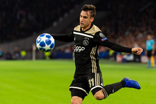 AMSTERDAM, NETHERLANDS - OCTOBER 23: Nicolas Tagliafico of Ajax controls the ball during the UEFA Champions League Group E match between Ajax and SL Benfica at Johan Cruyff Arena on October 23, 2018 in Amsterdam, Netherlands. (Photo by TF-Images/Getty Images)