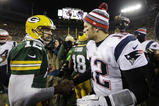 Green Bay Packers' Aaron Rodgers shakes hands with New England Patriots' Tom Brady after an NFL football game Sunday, Nov. 30, 2014, in Green Bay, Wis. The Packers won 26-21. (AP Photo/Tom Lynn)