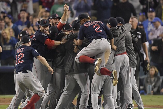 The Boston Red Sox celebrate after Game 5 of baseball's World Series against the Los Angeles Dodgers on Sunday, Oct. 28, 2018, in Los Angeles. The Red Sox won 5-1 to win the series 4 games to 1. (AP Photo/Mark J. Terrill)
