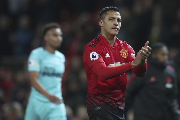 Manchester United's Alexis Sanchez walks from the pitch as he applauds the fans after the end of the English Premier League soccer match between Manchester United and Newcastle United at Old Trafford in Manchester, England, Saturday, Oct. 6, 2018. Man Utd won the game 3-2, with Sanchez scoring a late winner.(AP Photo/Jon Super)