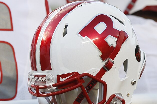 A Rutgers helmet hangs behind their bench during the first half of an NCAA college football game against Michigan Saturday, Nov. 7, 2015, in Ann Arbor, Mich. Michigan defeated Rutgers 49-16. (AP Photo/Duane Burleson)