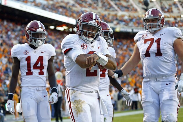 Alabama quarterback Jalen Hurts (2) celebrates after scoring a touchdown in the second half of an NCAA college football game against Tennessee Saturday, Oct. 20, 2018, in Knoxville, Tenn. Alabama won 58-21. (AP Photo/Wade Payne)