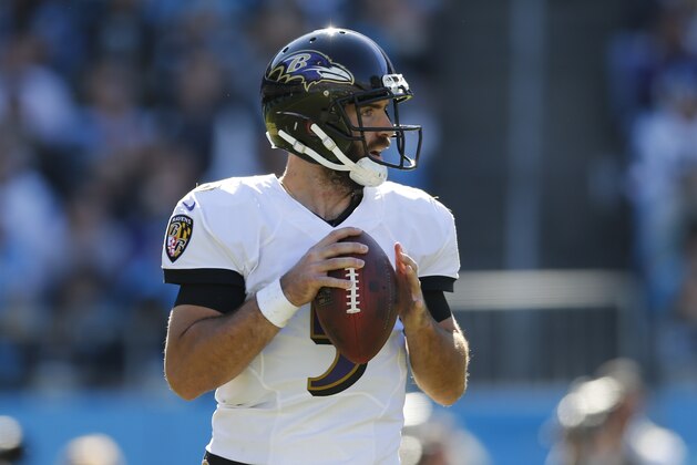 Baltimore Ravens' Joe Flacco (5) looks to pass against the Carolina Panthers in the second half of an NFL football game in Charlotte, N.C., Sunday, Oct. 28, 2018. (AP Photo/Nell Redmond)