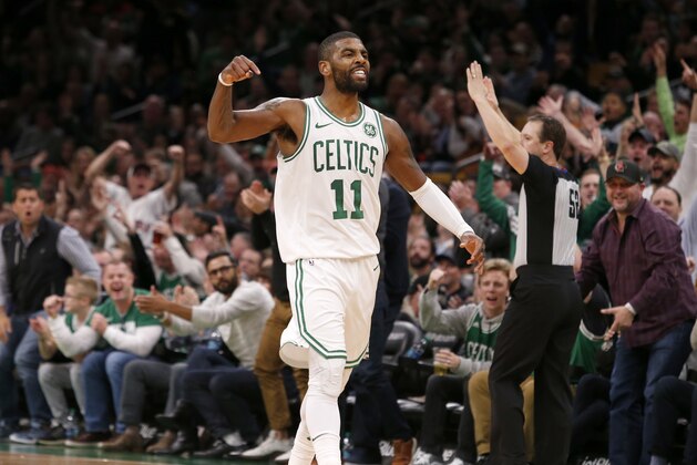 Boston Celtics guard Kyrie Irving (11) celebrates after hitting a three-point shot late in the second half of an NBA basketball game against the Detroit Pistons, Tuesday, Oct. 30, 2018, in Boston. (AP Photo/Mary Schwalm)