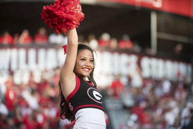A Georgia cheerleader roots on the Bulldogs during the second half of an NCAA college football game against South Carolina Saturday, Sept. 8, 2018, in Columbia, S.C. Georgia defeated South Carolina 41-17. (AP Photo/Sean Rayford)