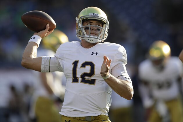 Notre Dame quarterback Ian Book warms up before facing Navy in an NCAA college football game Saturday, Oct. 27, 2018, in San Diego. (AP Photo/Gregory Bull)