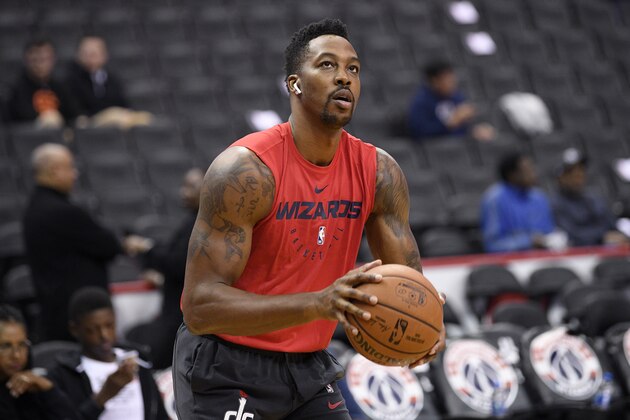 Washington Wizards center Dwight Howard (21) shoots around before an NBA basketball game against the Toronto Raptors, Saturday, Oct. 20, 2018, in Washington. (AP Photo/Nick Wass)