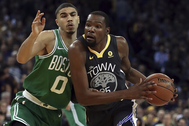 Golden State Warriors' Kevin Durant, right, drives the ball against Boston Celtics' Jayson Tatum (0) during the first half of an NBA basketball game Saturday, Jan. 27, 2018, in Oakland, Calif. (AP Photo/Ben Margot)