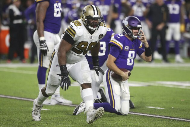 New Orleans Saints defensive tackle Sheldon Rankins celebrates after sacking Minnesota Vikings quarterback Kirk Cousins, right, during the first half of an NFL football game, Sunday, Oct. 28, 2018, in Minneapolis. (AP Photo/Jim Mone)