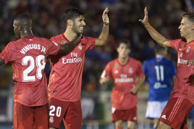 Real Madrid's Spanish midfielder Marco Asensio (C) celebrates a goal with teammates during the Spanish King's Cup (Copa del Rey) football match between UD Melilla and Real Madrid CF at the Alvarez Claro municipal stadium in the autonomous city of Melilla on October 31, 2018. (Photo by JORGE GUERRERO / AFP) (Photo credit should read JORGE GUERRERO/AFP/Getty Images) Real Madrid's Spanish midfielder Marco Asensio (C) celebrates a goal with teammates during the Spanish King's Cup (Copa del Rey) football match between UD Melilla and Real Madrid CF at the Alvarez Claro municipal stadium in the autonomous city of Melilla on October 31, 2018. (Photo by JORGE GUERRERO / AFP) (Photo credit should read JORGE GUERRERO/AFP/Getty Images)