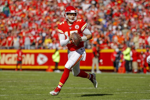 Kansas City Chiefs quarterback Patrick Mahomes (15) scrambles during the first half of an NFL football game against the Denver Broncos in Kansas City, Mo., Sunday, Oct. 28, 2018. (AP Photo/Charlie Riedel)