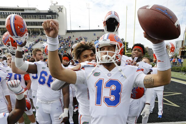 Florida quarterback Feleipe Franks (13) celebrates after the Gators defeated Vanderbilt 37-27 in an NCAA college football game Saturday, Oct. 13, 2018, in Nashville, Tenn. (AP Photo/Mark Humphrey)