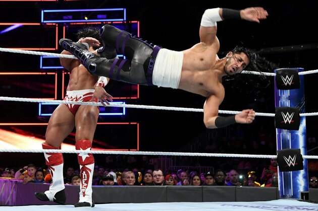 Mustafa Ali dropkicking Tony Nese