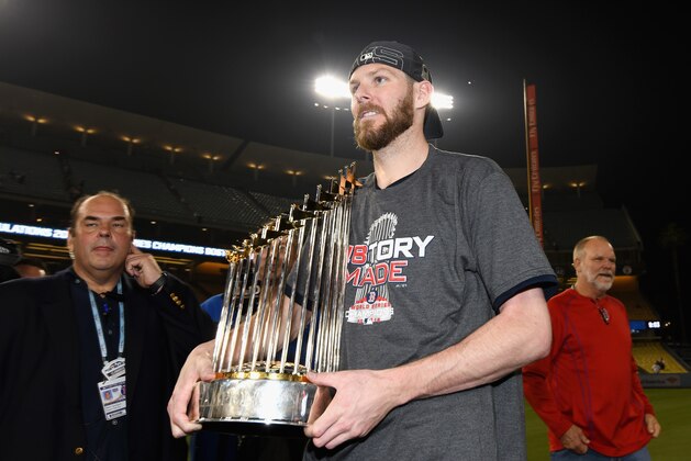 LOS ANGELES, CA - OCTOBER 28:  Chris Sale #41 of the Boston Red Sox celebrates with the World Series trophy after his team's 5-1 win over the Los Angeles Dodgers in Game Five of the 2018 World Series at Dodger Stadium on October 28, 2018 in Los Angeles, California.  (Photo by Harry How/Getty Images)