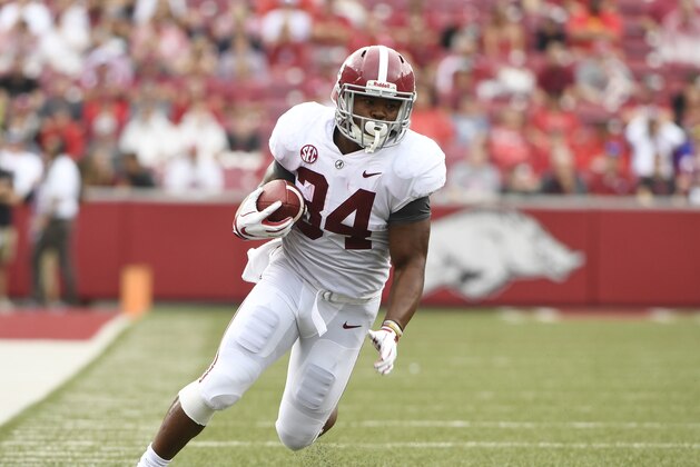 Alabama running back Damien Harris runs for a big gain against Arkansas in the first half of an NCAA college football game Saturday, Oct. 6, 2018, in Fayetteville, Ark. (AP Photo/Michael Woods)