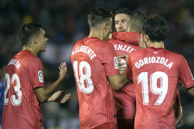 Real Madrid's Spanish defender Sergio Ramos (C) congratulates Real Madrid's French forward Karim Benzema (2R) for his goal during the Spanish King's Cup (Copa del Rey) football match between UD Melilla and Real Madrid CF at the Alvarez Claro municipal stadium in the autonomous city of Melilla on October 31, 2018. (Photo by JORGE GUERRERO / AFP)        (Photo credit should read JORGE GUERRERO/AFP/Getty Images)