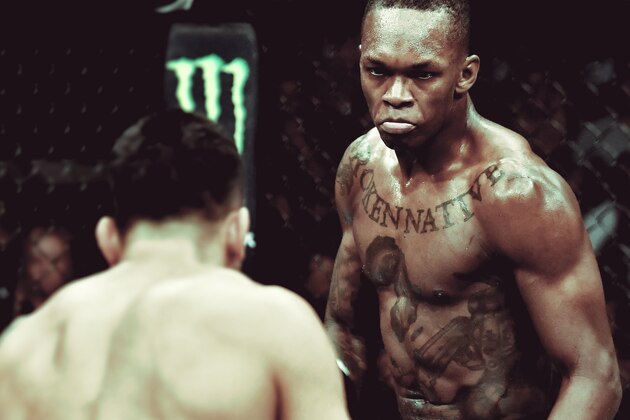 LAS VEGAS, NV - JULY 06:  (L-R) Israel Adesanya of Nigeria kicks Brad Tavares in their middleweight bout during The Ultimate Fighter Finale event inside The Pearl concert theater at Palms Casino Resort on July 6, 2018 in Las Vegas, Nevada. (Photo by Brandon Magnus/Zuffa LLC/Zuffa LLC via Getty Images)