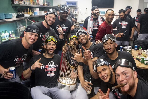LOS ANGELES, CA - OCTOBER 28: Bobby Poyner #11, Steve Pearce #25, J.D. Martinez #28, Edaurdo Nunez #36, Xander Bogaerts #2, Mookie Betts #50, Rafael Devers #11, Eduardo Rodriguez #57, and Christian Vazquez #7 of the Boston Red Sox celebrate with the World Series trophy in the clubhouse after winning the 2018 World Series in game five of the 2018 World Series against the Los Angeles Dodgers on October 28, 2018 at Dodger Stadium in Los Angeles, California. (Photo by Billie Weiss/Boston Red Sox/Getty Images) LOS ANGELES, CA - OCTOBER 28: Bobby Poyner #11, Steve Pearce #25, J.D. Martinez #28, Edaurdo Nunez #36, Xander Bogaerts #2, Mookie Betts #50, Rafael Devers #11, Eduardo Rodriguez #57, and Christian Vazquez #7 of the Boston Red Sox celebrate with the World Series trophy in the clubhouse after winning the 2018 World Series in game five of the 2018 World Series against the Los Angeles Dodgers on October 28, 2018 at Dodger Stadium in Los Angeles, California. (Photo by Billie Weiss/Boston Red Sox/Getty Images)