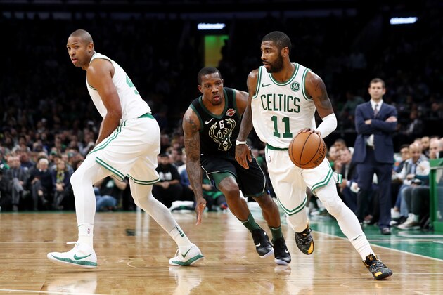 BOSTON, MA - NOVEMBER 1: Kyrie Irving #11 of the Boston Celtics drives against Eric Bledsoe #6 of the Milwaukee Bucks at TD Garden on November 1, 2018 in Boston, Massachusetts. (Photo by Maddie Meyer/Getty Images)
