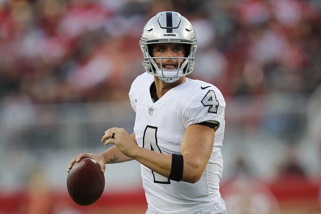 Oakland Raiders quarterback Derek Carr (4) looks to pass against the San Francisco 49ers during the first half of an NFL football game in Santa Clara, Calif., Thursday, Nov. 1, 2018. (AP Photo/John Hefti)