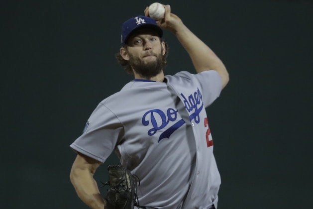 Los Angeles Dodgers starting pitcher Clayton Kershaw throws during the first inning of Game 1 of the World Series baseball game against the Boston Red Sox Tuesday, Oct. 23, 2018, in Boston. (AP Photo/Charles Krupa)