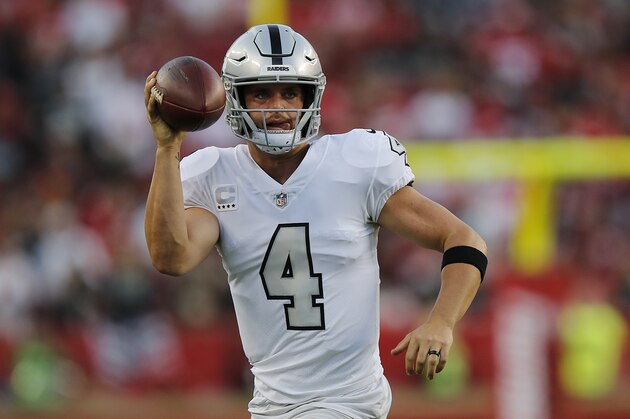 Oakland Raiders quarterback Derek Carr (4) looks to pass against the San Francisco 49ers during the first half of an NFL football game in Santa Clara, Calif., Thursday, Nov. 1, 2018. (AP Photo/John Hefti)