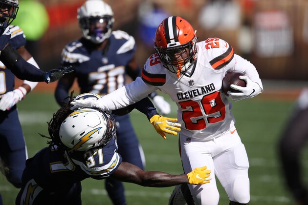CLEVELAND, OH - OCTOBER 14: Duke Johnson #29 of the Cleveland Browns runs the ball defined by Jahleel Addae #37 of the Los Angeles Chargers in the first half at FirstEnergy Stadium on October 14, 2018 in Cleveland, Ohio. (Photo by Gregory Shamus/Getty Images)