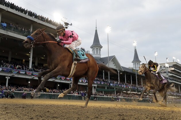 Joel Rosario rides Game Winner to victory in the Breeders' Cup Juvenile horse race at Churchill Downs, Friday, Nov. 2, 2018, in Louisville, Ky. (AP Photo/Darron Cummings)