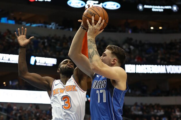 DALLAS, TEXAS - NOVEMBER 02:  Luka Doncic #77 of the Dallas Mavericks takes a shot against Tim Hardaway Jr. #3 of the New York Knicksat American Airlines Center on November 02, 2018 in Dallas, Texas.  NOTE TO USER: User expressly acknowledges and agrees that, by downloading and or using this photograph, User is consenting to the terms and conditions of the Getty Images License Agreement. (Photo by Ronald Martinez/Getty Images)