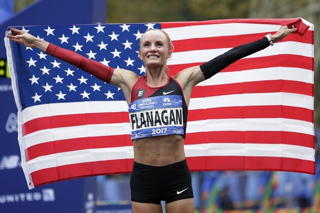 FILE - In this Nov. 5, 2017, file photo Shalane Flanagan, of the United States, poses for pictures after winning the the women's division of the New York City Marathon in New York. Flanagan, last year, became the first American woman in 40 years to win the NYC Marathon. Desiree Linden followed with a victory in Boston. All of which motivates Molly Huddle for Sunday's race in New York, who was third there in 2016 in her marathon debut. (AP Photo/Seth Wenig, File)