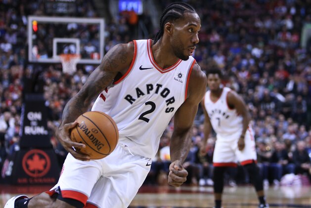 TORONTO, ON - OCTOBER 30:  Kawhi Leonard #2 of the Toronto Raptors dribbles the ball during the second half of an NBA game against the Philadelphia 76ers at Scotiabank Arena on October 30, 2018 in Toronto, Canada.  NOTE TO USER: User expressly acknowledges and agrees that, by downloading and or using this photograph, User is consenting to the terms and conditions of the Getty Images License Agreement.  (Photo by Vaughn Ridley/Getty Images)