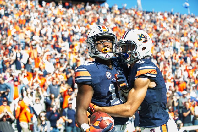 AUBURN, AL - NOVEMBER 3: Wide receiver Seth Williams #18 of the Auburn Tigers celebrates with wide receiver Anthony Schwartz #5 of the Auburn Tigers after scoring the game winning touchdown during the fourth quarter against the Texas A&M Aggies at Jordan-Hare Stadium on November 3 2018 in Auburn, Alabama. (Photo by Michael Chang/Getty Images)