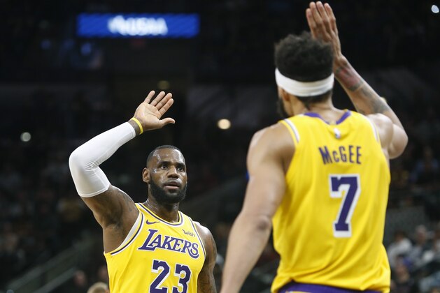 SAN ANTONIO,TX - OCTOBER 27:  LeBron James #23 of the Los Angeles Lakers high fives JaVale McGee #7 of the Los Angeles Lakers after a alley opps pass against the San Antonio Spurs at AT&T Center on October 27 , 2018  in San Antonio, Texas.  NOTE TO USER: User expressly acknowledges and agrees that , by downloading and or using this photograph, User is consenting to the terms and conditions of the Getty Images License Agreement. (Photo by Ronald Cortes/Getty Images)