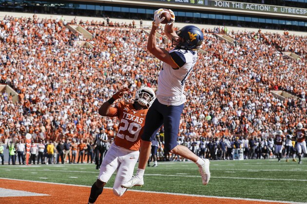AUSTIN, TX - NOVEMBER 03:  David Sills V #13 of the West Virginia Mountaineers catches a pass for a touchdown defended by Josh Thompson #29 of the Texas Longhorns in the second quarter at Darrell K Royal-Texas Memorial Stadium on November 3, 2018 in Austin, Texas.  (Photo by Tim Warner/Getty Images)