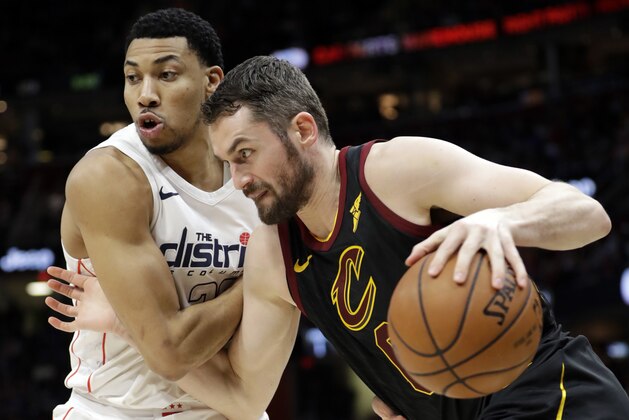 Cleveland Cavaliers' Kevin Love, right, drives past Washington Wizards' Otto Porter Jr. in the first half of an NBA basketball game, Thursday, April 5, 2018, in Cleveland. (AP Photo/Tony Dejak)