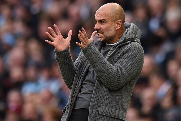 Manchester City's Spanish manager Pep Guardiola gestures on the touchline during the English Premier League football match between Manchester City and Southampton at the Etihad Stadium in Manchester, north west England, on November 4, 2018. (Photo by Oli SCARFF / AFP) / RESTRICTED TO EDITORIAL USE. No use with unauthorized audio, video, data, fixture lists, club/league logos or 'live' services. Online in-match use limited to 120 images. An additional 40 images may be used in extra time. No video emulation. Social media in-match use limited to 120 images. An additional 40 images may be used in extra time. No use in betting publications, games or single club/league/player publications. /         (Photo credit should read OLI SCARFF/AFP/Getty Images)