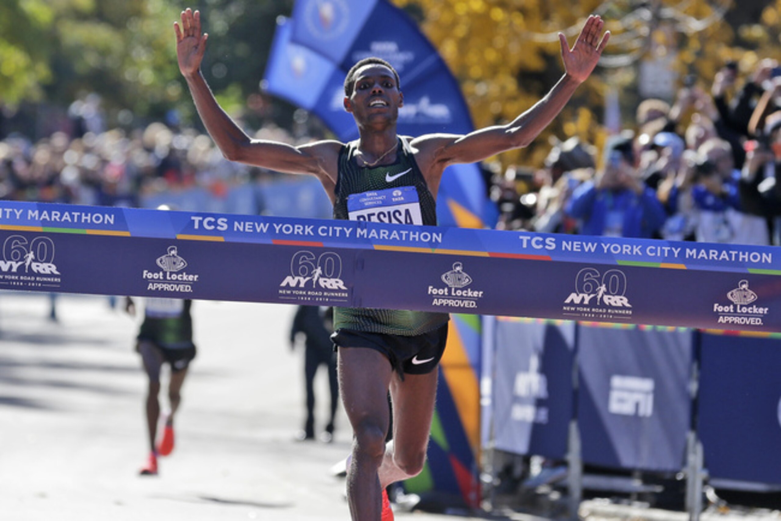 Lelisa Desisa, of Ethiopia, crosses the finish line first in the men's division of the New York City Marathon in New York, Sunday, Nov. 4, 2018. (AP Photo/Seth Wenig) Lelisa Desisa, of Ethiopia, crosses the finish line first in the men's division of the New York City Marathon in New York, Sunday, Nov. 4, 2018. (AP Photo/Seth Wenig)