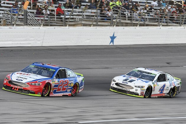 Kevin Harvick (4) battles Joey Logano (22) for position during a NASCAR Cup auto race at Texas Motor Speedway, Sunday, Nov. 4, 2018, in Fort Worth, Texas. (AP Photo/Larry Papke)