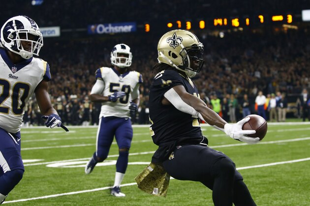 New Orleans Saints running back Alvin Kamara (41) scores on a touchdown carry ahead of Los Angeles Rams free safety Lamarcus Joyner (20) and inside linebacker Cory Littleton (58) in the first half of an NFL football game in New Orleans, Sunday, Nov. 4, 2018. (AP Photo/Butch Dill)