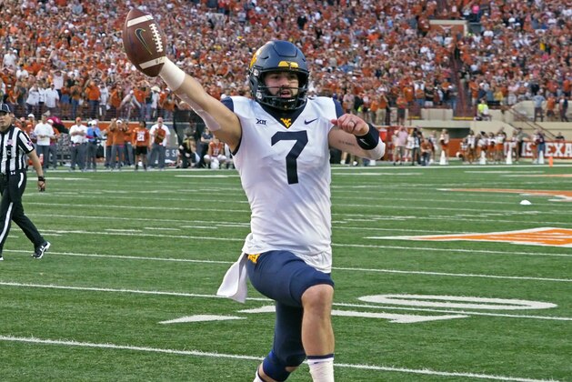 West Virginia quarterback Will Grier runs in the game winning two point conversion with 16 second to go in an NCAA college football game against Texas, Saturday, Nov. 3, 2018, in Austin, Texas. West Virginia won 42-41. (AP Photo/Michael Thomas) West Virginia quarterback Will Grier runs in the game winning two point conversion with 16 second to go in an NCAA college football game against Texas, Saturday, Nov. 3, 2018, in Austin, Texas. West Virginia won 42-41. (AP Photo/Michael Thomas)
