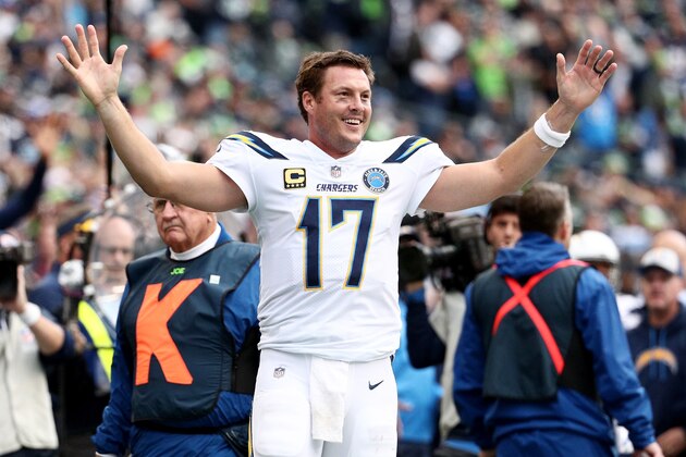 SEATTLE, WASHINGTON - NOVEMBER 04:  Philip Rivers #17 of the Los Angeles Chargers celebrates in the fourth quarter against the Seattle Seahawks at CenturyLink Field on November 04, 2018 in Seattle, Washington. (Photo by Abbie Parr/Getty Images)