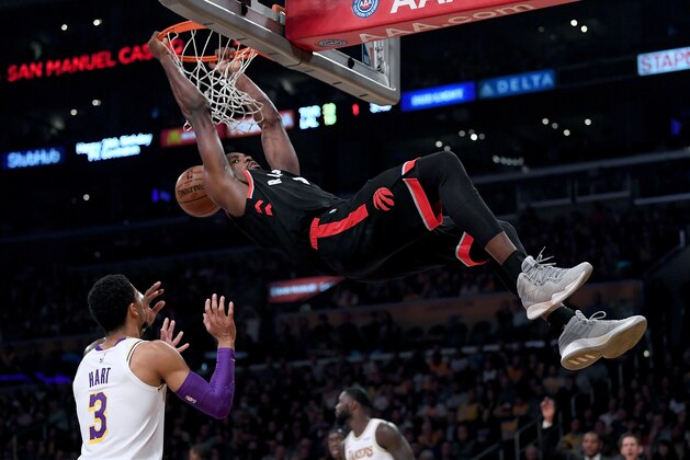 LOS ANGELES, CA - NOVEMBER 04:  Serge Ibaka #9 of the Toronto Raptors dunks in front of Josh Hart #3 of the Los Angeles Lakers during the first half at Staples Center on November 4, 2018 in Los Angeles, California.  (Photo by Harry How/Getty Images)