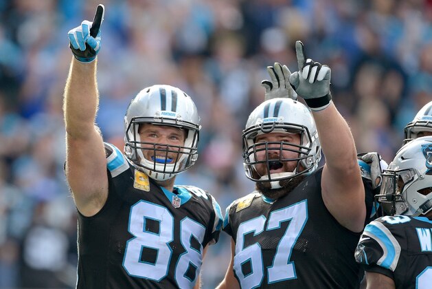 CHARLOTTE, NC - NOVEMBER 04:  Greg Olsen #88 of the Carolina Panthers celebrates with Ryan Kalil #67  after scoring a touchdown against the Tampa Bay Buccaneers during the first half of their game at Bank of America Stadium on November 4, 2018 in Charlotte, North Carolina.  (Photo by Grant Halverson/Getty Images)