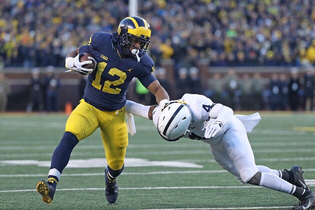 ANN ARBOR, MI - NOVEMBER 03: Chris Evans #12 of the Michigan Wolverines runs for a first down during the fourth quarter of the game against the Penn State Nittany Lions at Michigan Stadium on November 3, 2018 in Ann Arbor, Michigan. Michigan defeated Penn State 42-7. (Photo by Leon Halip/Getty Images) ANN ARBOR, MI - NOVEMBER 03: Chris Evans #12 of the Michigan Wolverines runs for a first down during the fourth quarter of the game against the Penn State Nittany Lions at Michigan Stadium on November 3, 2018 in Ann Arbor, Michigan. Michigan defeated Penn State 42-7. (Photo by Leon Halip/Getty Images)